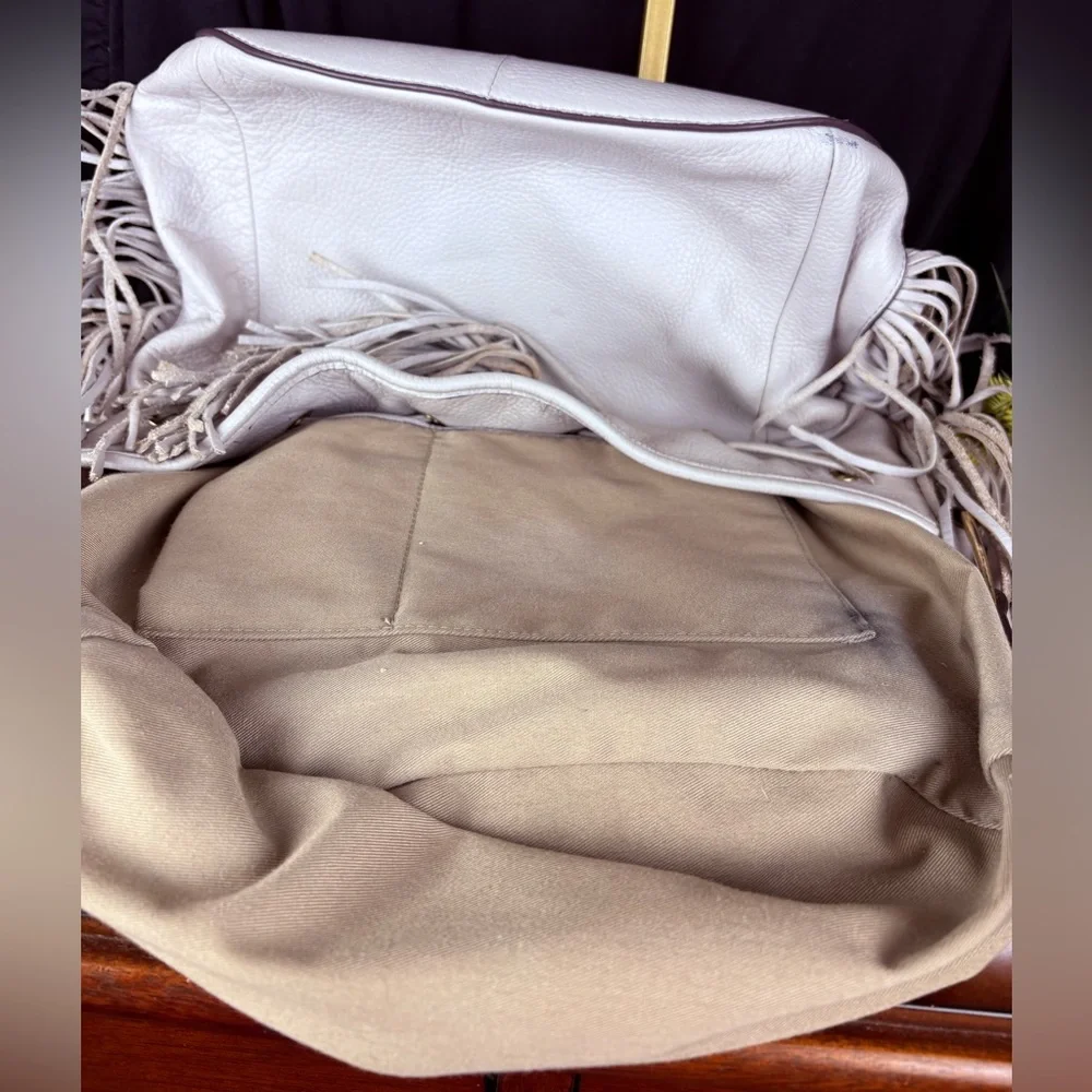 G.I.L.I. Got It. Love It. White Pebbled Leather Drawstring Hobo Tassel